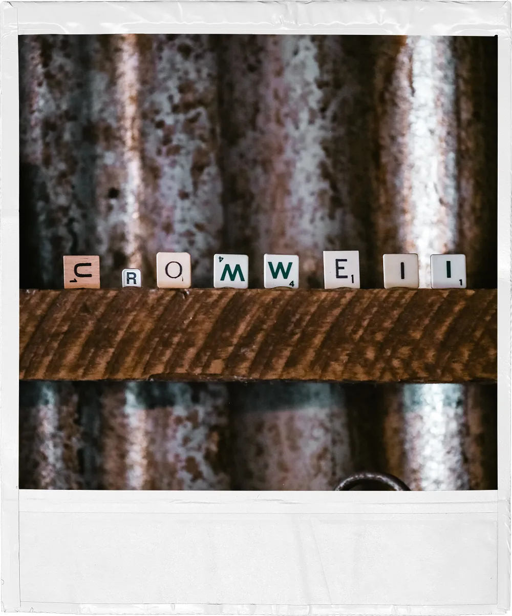 a picture of a piece of wood with the word Cromwell spelled on it